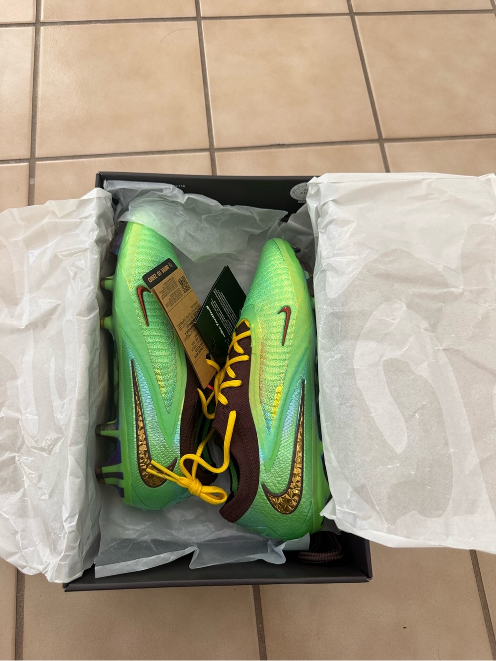 Nike Green Soccer Cleats with Yellow Laces and Brown Accents
